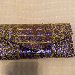 Nearly brand new Brahmin wallet in purple and neon green over crocodile print.